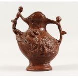 A BROWN POTTERY STONEWARE JUG 7.5ins high.