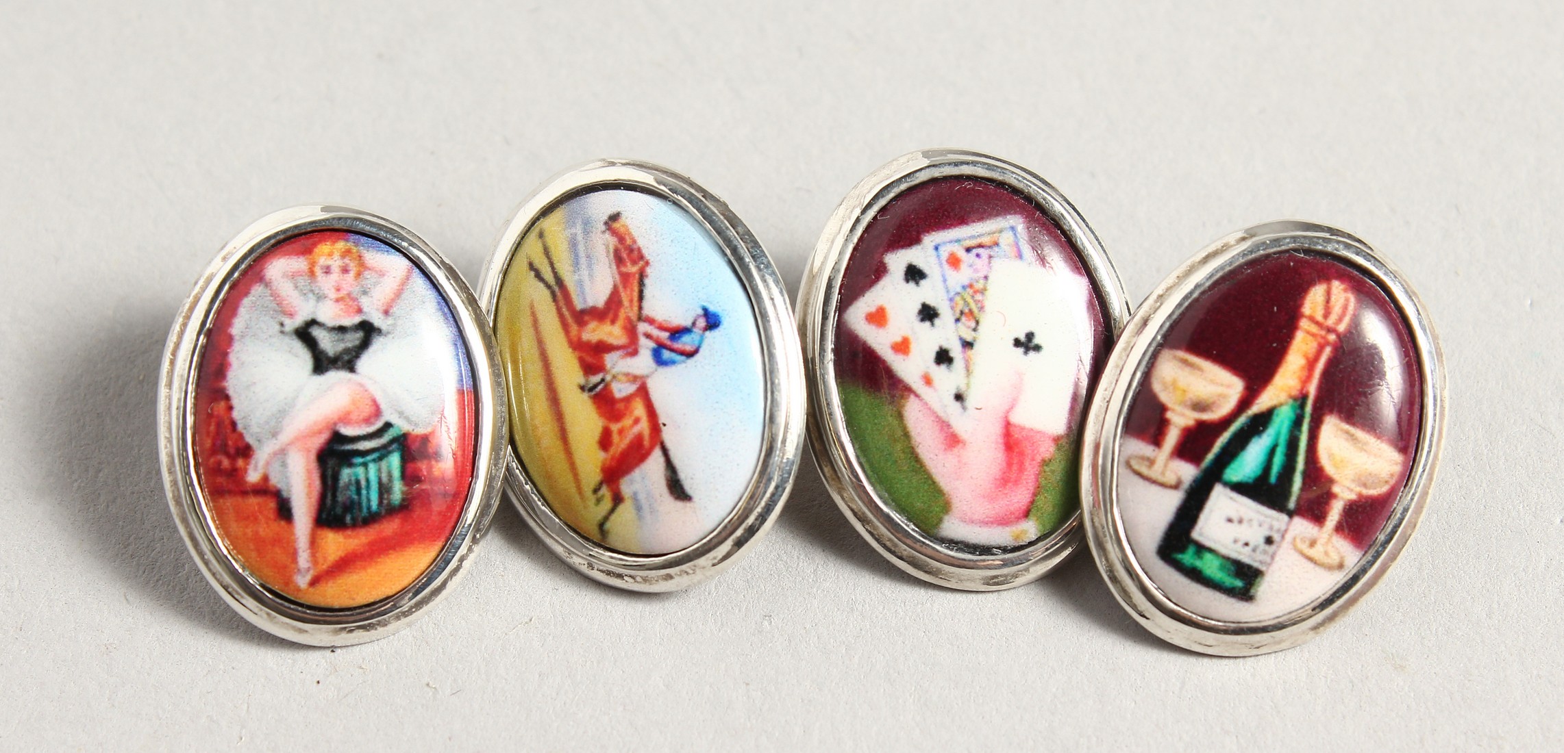 A SILVER AN ENAMEL 4 VICES CUFF LINKS