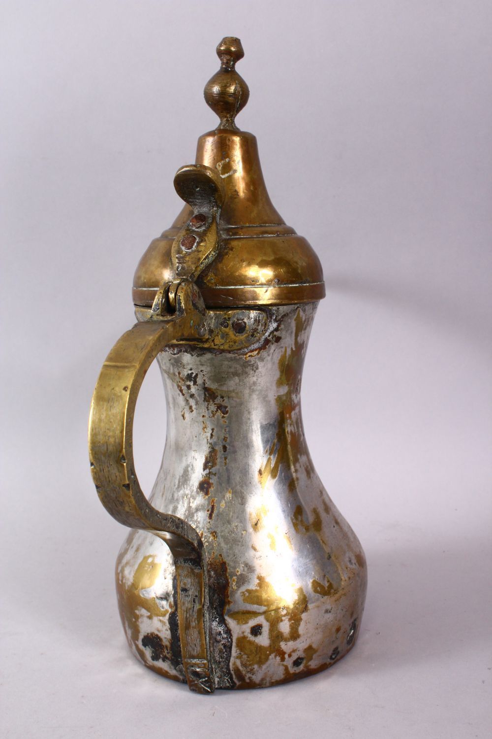 AN 19TH CENTURY ISLAMIC SILVERED BRASS SIGNED DALLAH / COFFEE POT, with an impressed signature to - Image 5 of 5