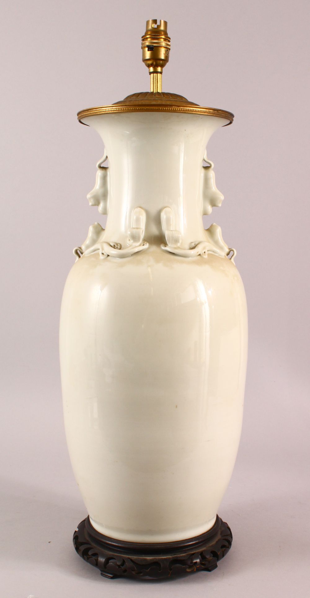 A LARGE CHINESE MONOCHROME PORCELAIN TWIN HANDLE VASE / LAMP, the lamp with a monotone colour,