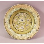 A GREEN GLAZED TIMURID POTTERY DISH, with floral motif decoration, 21cm