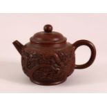 A CHINESE YIXING CLAY DRAGON TEAPOT, with heavily moulded dragon & cloud decoration, the base with
