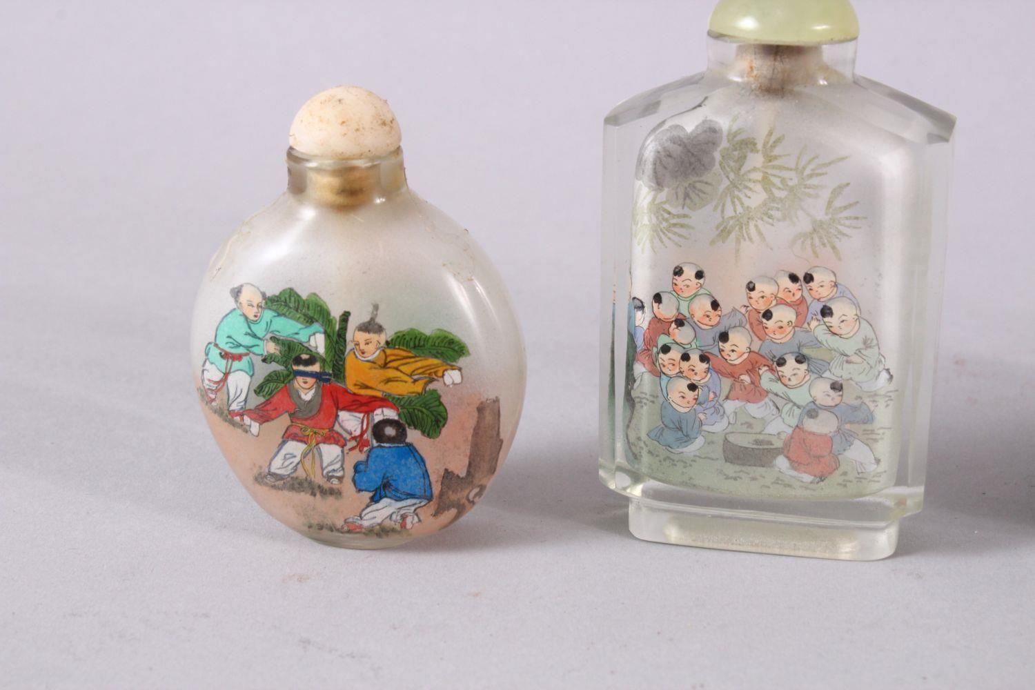 A MIXED LOT OF 5 CHINESE REVERSE PAINTED SNUFF BOTTLES, each with decoration of boys in - Image 2 of 9