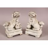 A CHINESE BLANC DE CHINE PORCELAIN FIGURES OF DOGS, formed as incense holders, 13cm