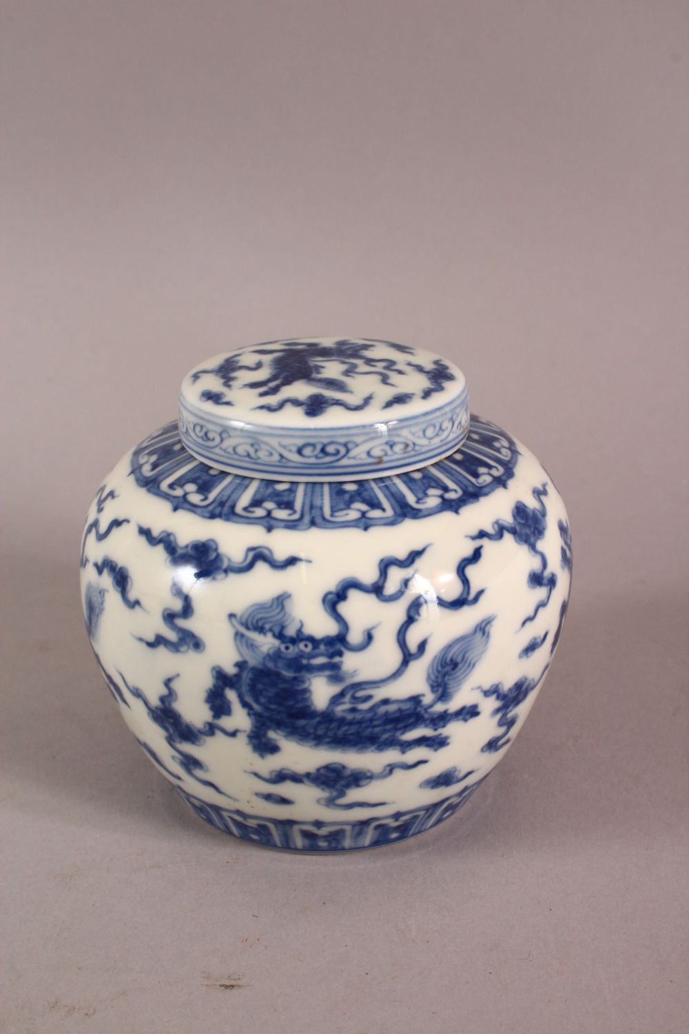 A CHINESE BLUE & WHITE PORCELAIN JAR & COVER, with decoration of kylin and clouds, base with a mark, - Image 4 of 7