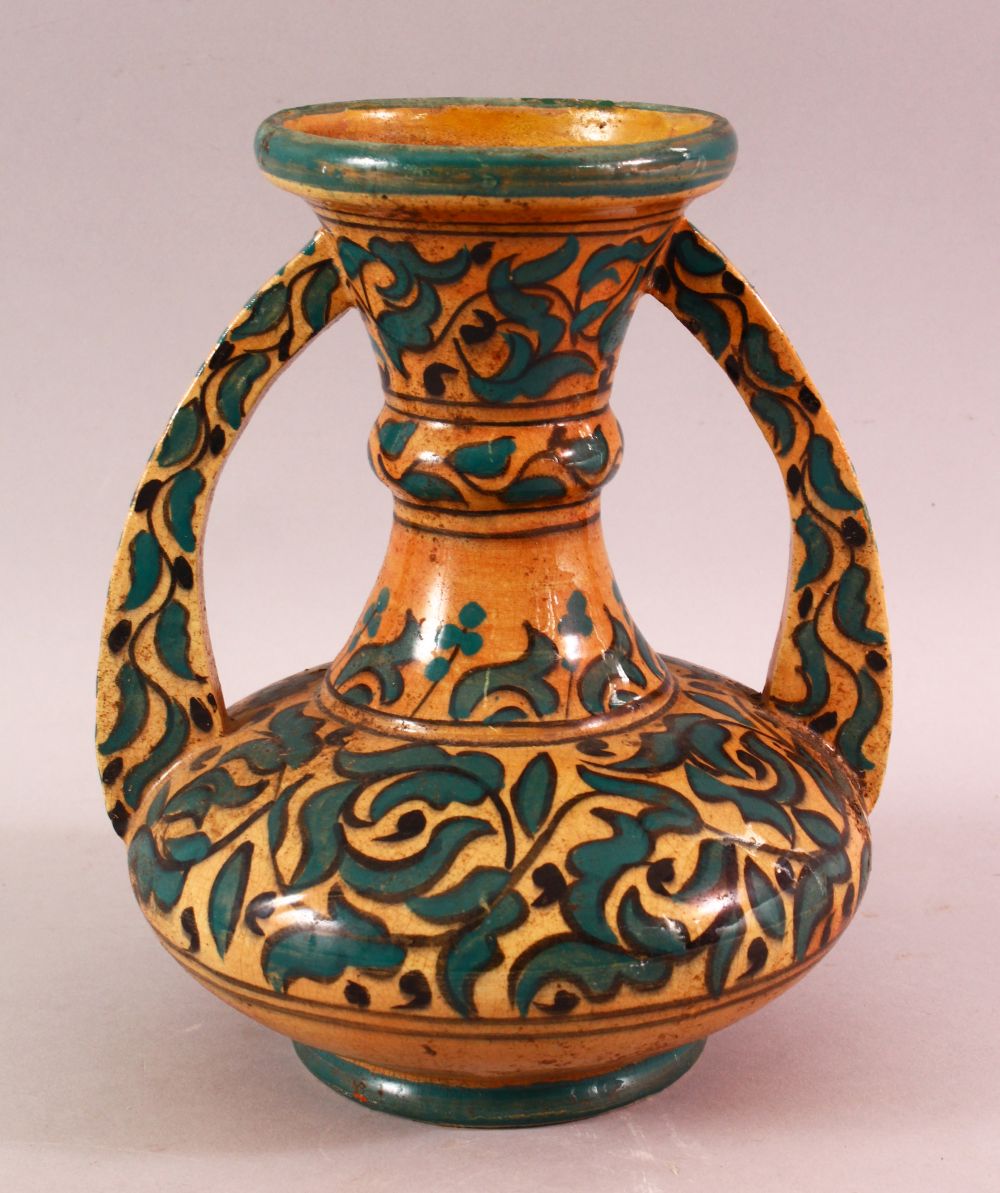 A MOROCCAN POTTERY FLORAL VASE - SIGNED BY BIN JALAL, with twin handles and green foliage