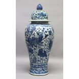 A LARGE 20TH CENTURY KANGXI STYLE BLUE AND WHITE FLOOR STANDING VASE AND COVER, the body painted