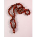 A RHINO HORN BEAD NECKLACE, beads approx 10mm diameter, weight 65g.