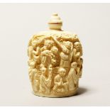 A CHINESE CARVED IVORY SCENT BOTTLE, surrounded by figures, 3ins high.