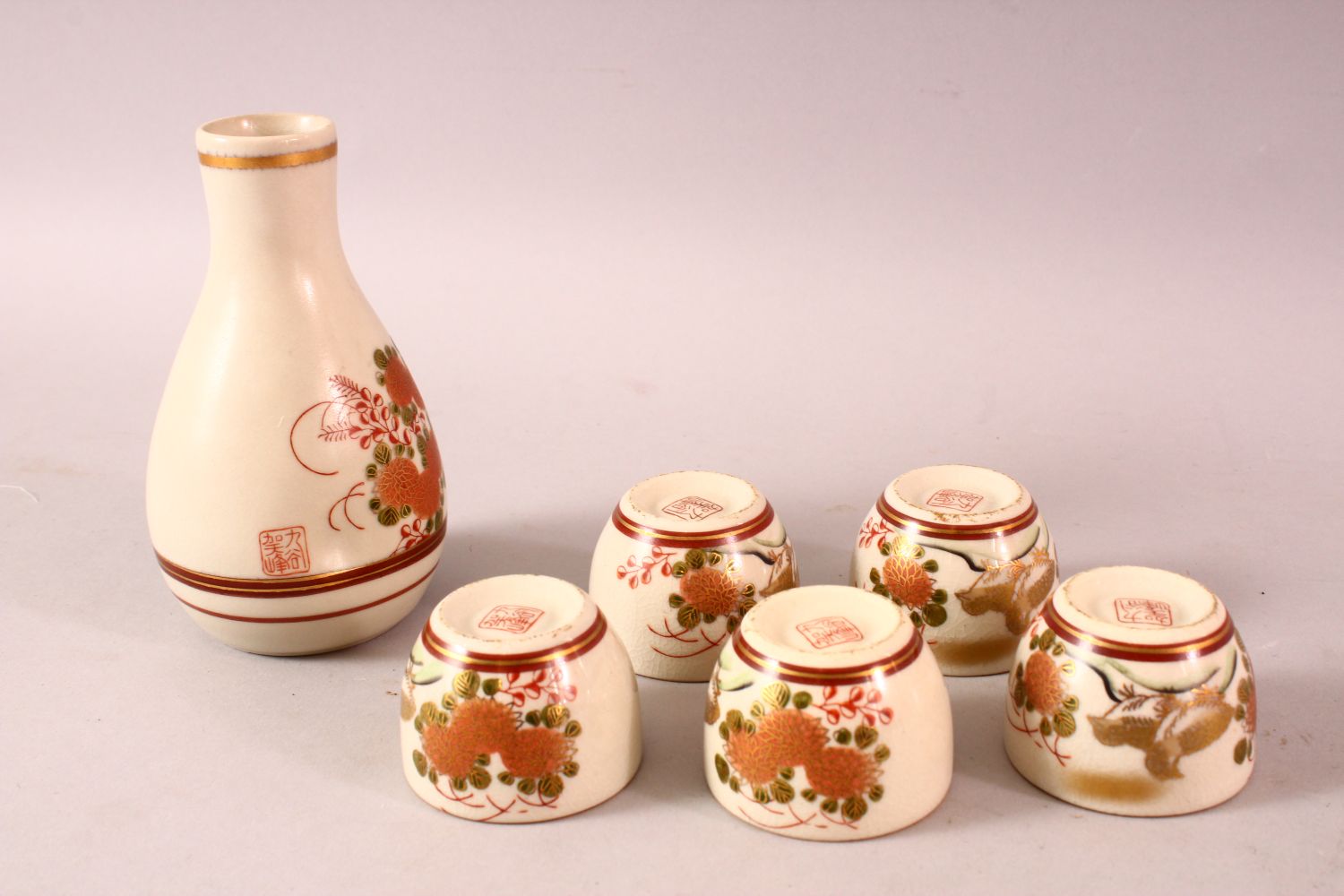 A JAPANESE PORCELAIN SAKE SET, five cups and one bottle, decorated with quail and flora, 13cm the - Image 2 of 4