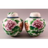 A PAIR OF CHINESE CLOISONNE GINGER JARS & COVERS, each with a white ground and floral decoration,