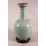 A CHINESE SONG STYLE RU WARE VASE, with incised calligraphy to the body, ribbed neck and carved