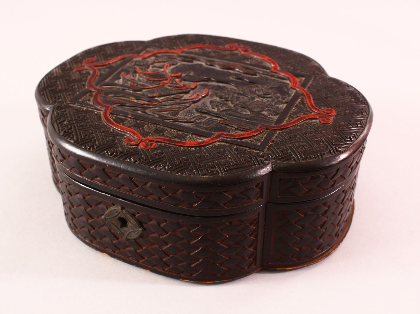 A CHINESE WOOD & LACQUER BOX, of weave style form, with a landscape view, 19.5cm