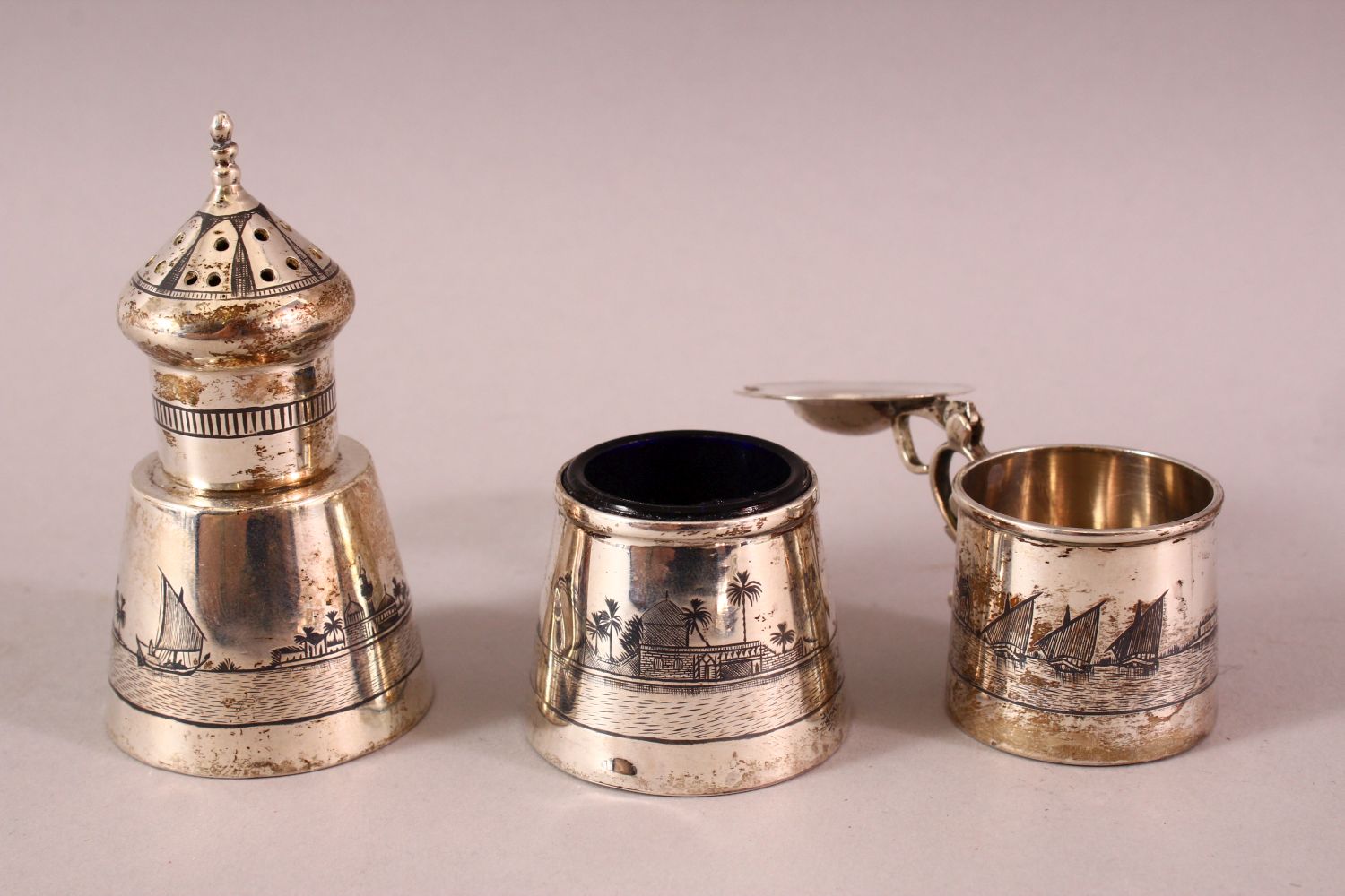 AN IRAQI SILVER AND NIELLO THREE PIECE CRUET SET AND STAND, combined weight excluding liner 160g. - Image 2 of 4