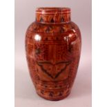 A LARGER NORTH AFRICAN RED GLAZED POTTERY VASE, with floral motif decoration, 31cm