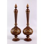 A PAIR OF ISLAMIC DAMASCENE INLAID STEEL BOTTLE & COVERS, each with gold inlaid panels of star