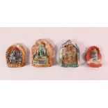FOUR TIBETAN POTTERY MOULDED PANELS, each depicting a beast or buddha figure, 11cm down to 8cm (4)