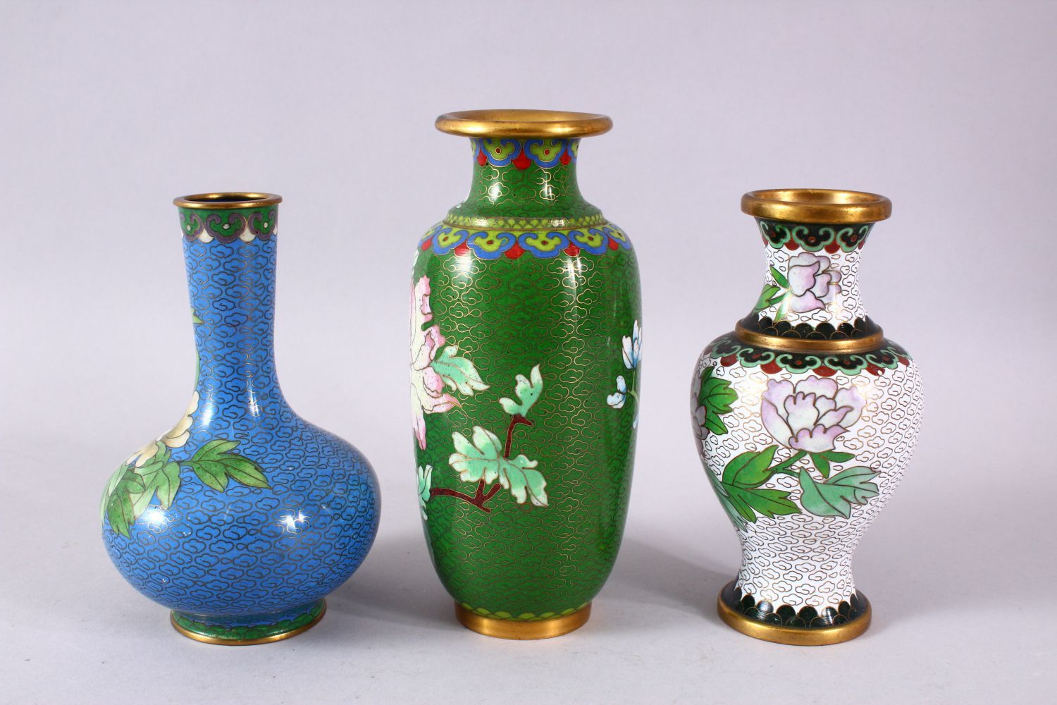 A MIXED LOT OF THREE CHINESE CLOISONNE VASES - the largest with a green ground with native Lotus - Image 7 of 8