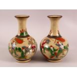 A PAIR OF CHINESE FAMILLE ROSE CRACKLEGLAZE CARNIVAL VASES, the bases with four character marks,