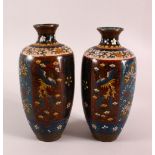 A PAIR OF JAPANESE CLOISONNE VASES, decorated with phoenix, flowers and butterflies, 22cm high.
