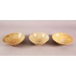 THREE EARLY CHINESE POTTERY BOWLS, of varying style and size (3)