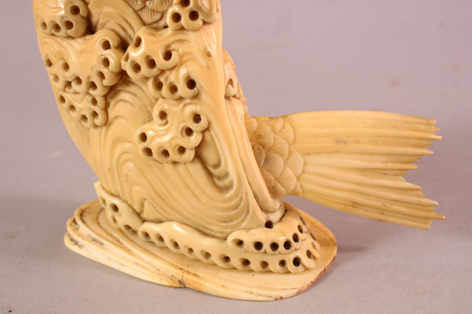 A JAPANESE MEIJI PERIOD CARVED IVORY FISH OKIMONO, the fish emerging from the water with a boy on - Image 7 of 9