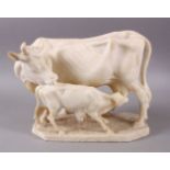 A 19TH CENTURY INDIAN ALABASTER MODEL OF NANDI COWS - the larger cow depicted with young, 25cm