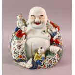 A GOOD CHINESE REPUBLIC PERIOD FAMILLE ROSE PORCELAIN FIGURE OF BUDDHA, seated with young attendant,