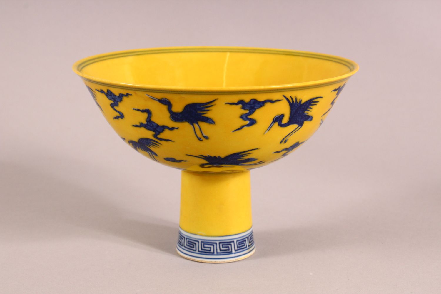 A CHINESE YELLOW GROUND PORCELAIN STEM CUP, decorated with cranes in flight, the interior of the - Image 2 of 6