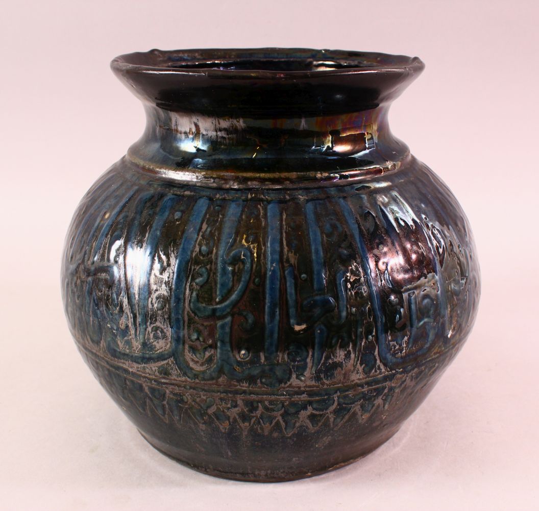 A MAMLUK STYLE POTTERY CALLIGRAPHIC VASE, with a dark blue to black ground with calligraphy bands,