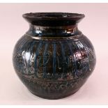 A MAMLUK STYLE POTTERY CALLIGRAPHIC VASE, with a dark blue to black ground with calligraphy bands,
