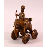 A 19TH CENTURY INDIAN BRONZE ELEPHANT TOY, the elephant on wheels with a man seated, 13.5cm