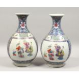 A GOOD PAIR OF KANGXI DESIGN BLUE GROUND BULBOUS VASES, painted with figures.