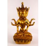 A LARGE CHINESE GILT BRONZE FIGURE OF A MULIT FACED BUDDHA, in a seated pose with multi arms, upon