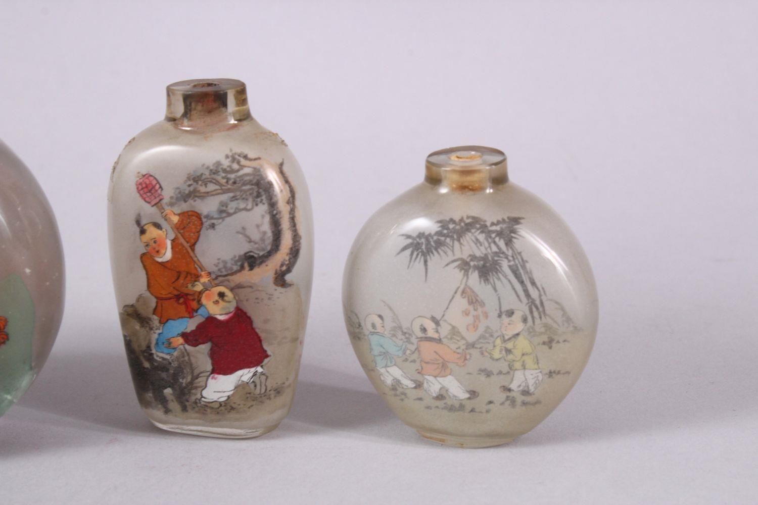 A MIXED LOT OF 5 CHINESE REVERSE PAINTED SNUFF BOTTLES, each with decoration of boys in - Image 4 of 9