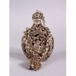 A CHINESE WHITE METAL OPENWORK SNUFF BOTTLE, with decoration in openwork and depicting immortal