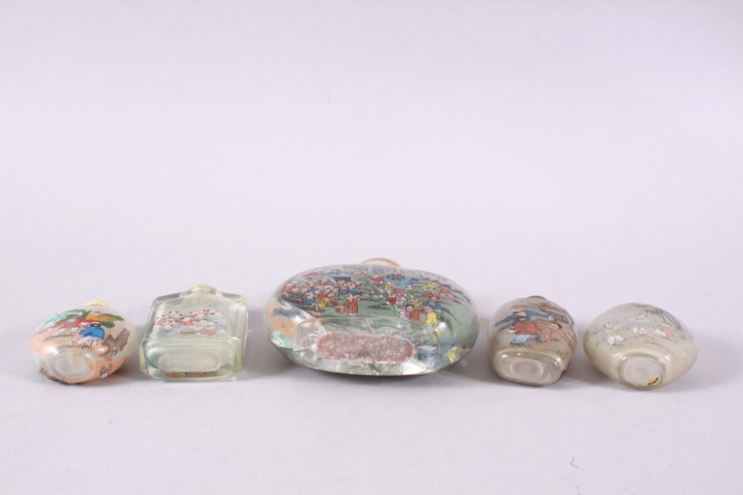 A MIXED LOT OF 5 CHINESE REVERSE PAINTED SNUFF BOTTLES, each with decoration of boys in - Image 9 of 9