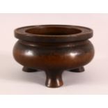 A CHINESE XUANDE STYLE BRONZE TRIPOD CENSER, underside with a mark, 16cm