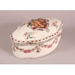 A CHINESE FAMILLE ROSE PORCELAIN BOX AND COVER, with floral decoration and a central crest, mark