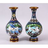 A PAIR OF CHINESE CLOISONNE CRANE VASES - each of the globular formed vases with two main panels