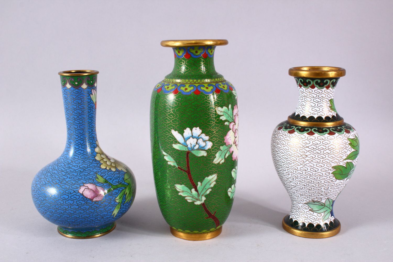 A MIXED LOT OF THREE CHINESE CLOISONNE VASES - the largest with a green ground with native Lotus - Image 5 of 8