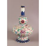 A CHINSE UNUSUAL FORMED FAMILLE ROSE PORCELIAN VASE, decorated with scrolling lotus display, the