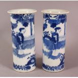 A PAIR OFF CHINESE BLUE & WHITE PORCELAIN VASES, depicting figures in a landscape, 15cm