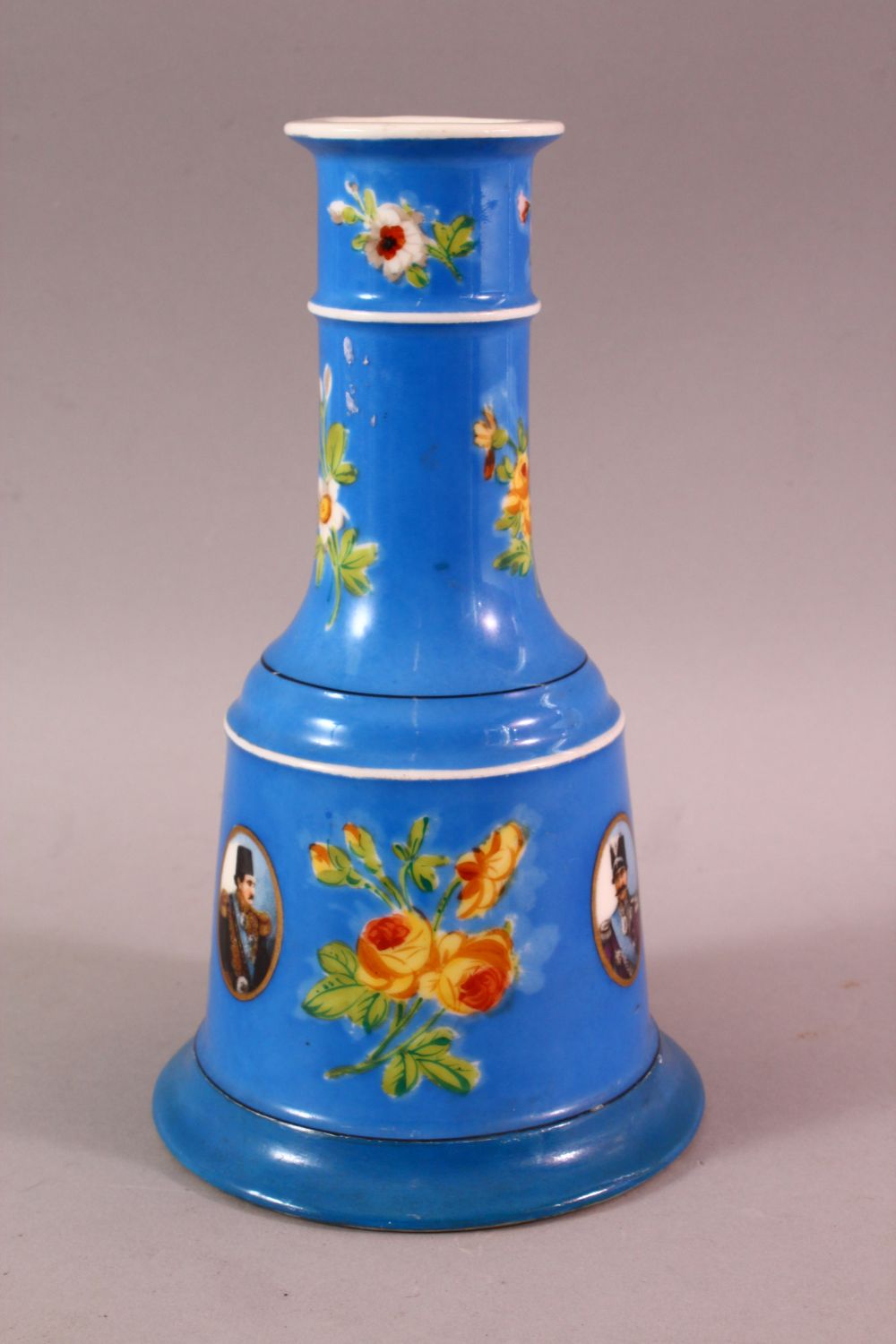 A PERSIAN QAJAR PORCELAIN HUQQA BASE, with ablue ground and figural decoration around flora, 23cm - Image 3 of 7