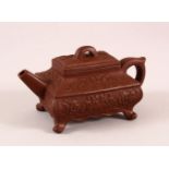 A CHINESE YIXING CLAY TEAPOT, with a moulded body of foliage, the base with an impressed mark,