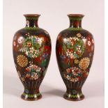 A PAIR OF SMALL CLOISONNE VASES OF RIBBED BALUSTER FORM, decorated with roundels of flowers, 15cm