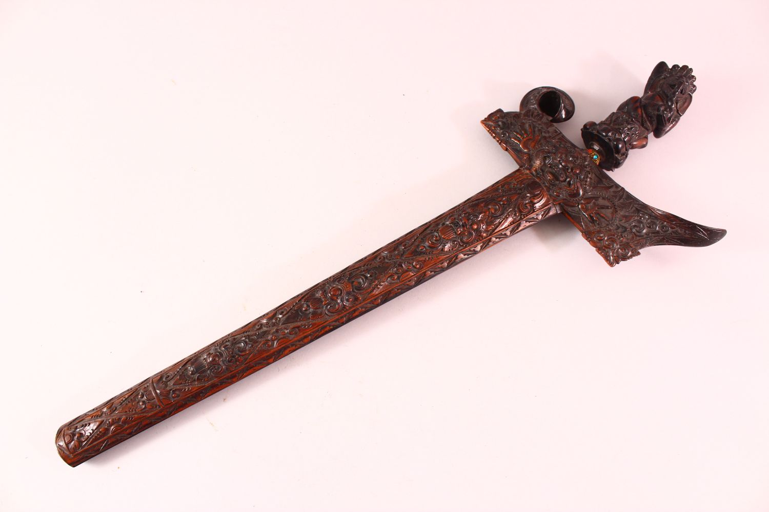 A GOOD INDONESIAN CARVED WOODEN SWORD / DAGGER, the well carved dagger with an elephant carved deity - Image 2 of 10