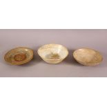 THREE EARLY CHINESE POTTERY BOWLS, of varying style and size (3)