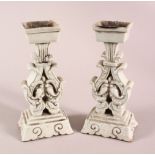 A PAIR OF CHINESE DEHUA PORCELAIN CANDLE STICKS, 18cm high.