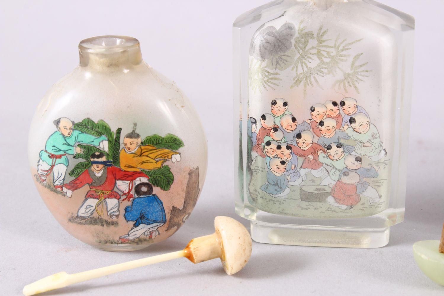 A MIXED LOT OF 5 CHINESE REVERSE PAINTED SNUFF BOTTLES, each with decoration of boys in - Image 6 of 9